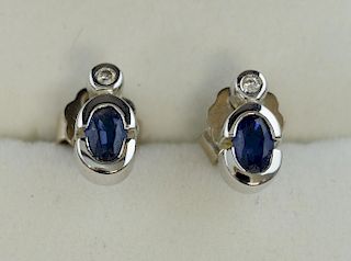 A pair of sapphire and diamond earrings, mounted in 18 ct white gold.