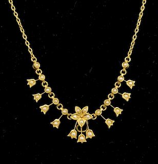 Edwardian gold and seed pearl necklace with a flower motif to the centre, chain stamped 15ct
