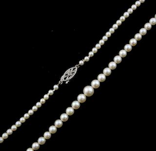 Pearl necklace, of graduating pearls, with white gold clasp, in Mikimoto box with receipt, clasp possibly a replacement