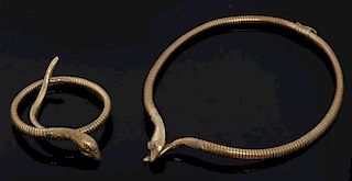 Gold snake necklace and bracelet, each on a gas pipe style link with  to the snakes head with ruby set eyes. Hallmarked 9 ct 