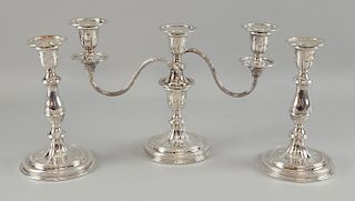 Silver plated three light candelabra and a pair of matching candle sticks.