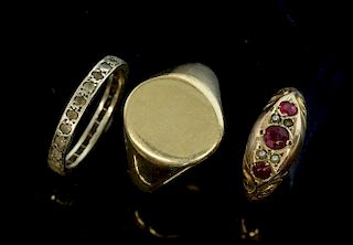 Gold signet ring in 9ct gold, Edwardian garnet and seed pearl 9ct gold ring and a white stone eternity ring.