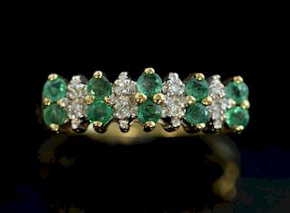 Emerald and diamond dress ring mounted in 9 ct yellow gold.
