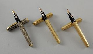 Three Sheaffer gold plated fountain pens.