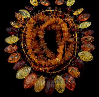 Three amber necklaces, two irregular form beads and another heated amber leaf forms