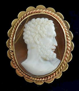 Carved shell cameo brooch depicting a profile of Greek gentleman mounted in 9 ct yellow gold.