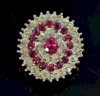 Ruby and diamond cluster ring mounted in 9ct yellow gold.