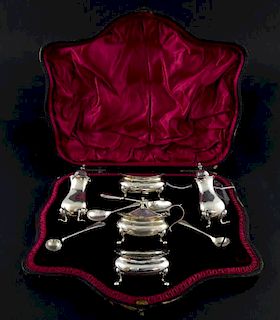 Victorian silver cruet set, comprising two salts, two pepperettes and mustard pot and cover, and two silver spoons, all Londo