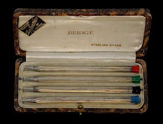 Modern Sterling silver set of four Bridge pencils with engine turned decoration, in fitted case,