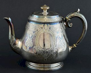 Victorian silver teapot with engraved decoration on round foot, by Atkin Brothers, Sheffield, 1873, gross weight 23oz, 715g,