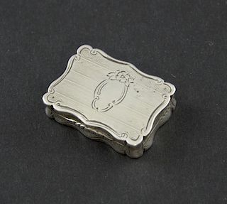 Victorian silver vinaigrette of serpentine form by maker's mark 'AT', vacant cartouche, Birmingham, 1866,
