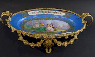19th century French tourquise ground oval plate, the centre  with loving couple, Double L  mark  base, with gilt metal mounts