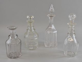 Three ring neck decanters and a mallet shaped decanter, the tallest 28cm.