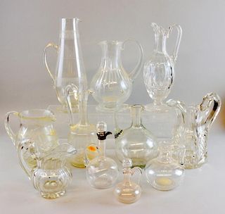A tall acid etched water jug, 31cm, together with ten other jugs and bottles. (11)