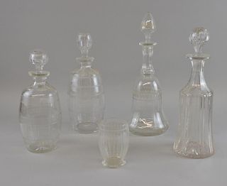 Two mallet shaped decanters and two barrel shaped decanters. and a similar glass, The tallest 33cm