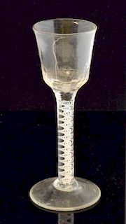 An 18th century cotton twist cordial glass with fluted bowl, pontil mark to foot 15cm. high