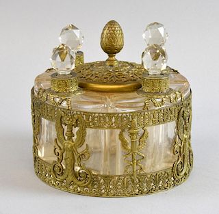 Set of four cut glass and gilt metal mounted scent bottles all in a single holder, 12cm high,