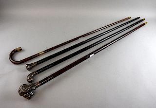 20th century walking stick with white metal finial in the form of a lions head 94cm and three other canes