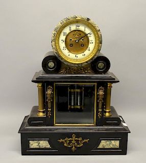 19th century polished slate and gilt metal mantel clock in architectural form, the dial with visible escarpment, two train mo