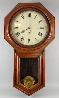 Mahogany cased drop dial wall clock with a single train eight day movement, white enamel dial with Roman numerals.