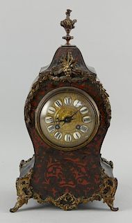 Boulle, ebonized and gilt metal mantle clock, the French eight day movement striking the hours and half hours on a bell. 37 c