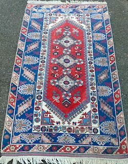 Persian type blue ground rug the centre with three medallions, 210cm x 124cm