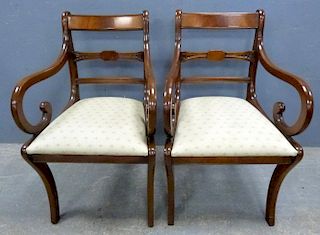 Set of eight Regency style mahogany arm  chairs with drop in seats on sabre legs