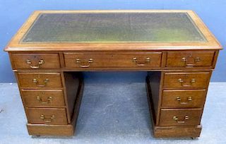 Early 20th century oak pedestal desk on nine drawers, 70cm x 120cm x 59cm,