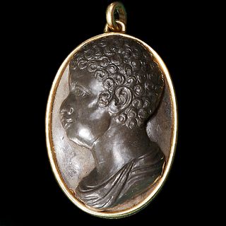 MAGNIFICENT CARVED PENDANT.