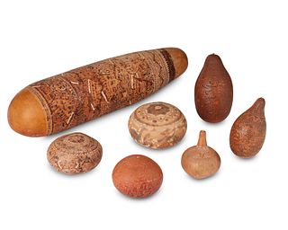 A group of Peruvian carved gourds
