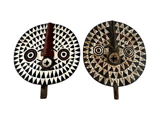 Pair of antique carved wood African tribal mask