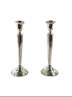 PAIR OF CARTIER STERLING WEIGHTED CANDLE STICKS