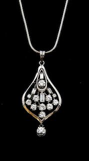 Diamond set white gold  pendant, open work  tear drop form, set with baguette and brilliant cut stones, total diamond weight