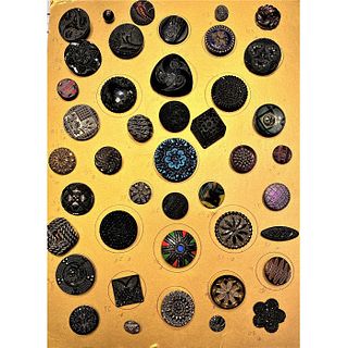A CARD OF DIVISION ONE ASSORTED BLACK GLASS BUTTONS