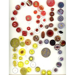 A CARD OF DIVISION 3 GLASS BUTTONS IN ASSORTED COLORS