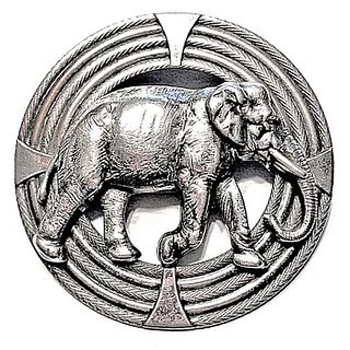 A DIVISION THREE FRENCH WHITE ELEPHANT BUTTON