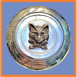 A DIVISION ONE BRASS AND PEARL KITTY CAT BUTTON
