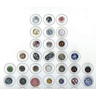 A SMALL CARD OF DIVISION ONE PAPERWEIGHT BUTTONS