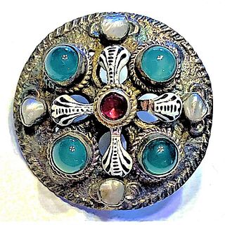 A DIVISION ONE ENAMEL AND GEMSTONE SET BUTTON