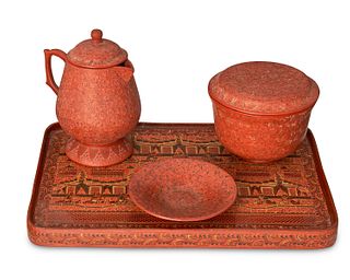 A group of Burmese etched red lacquerware