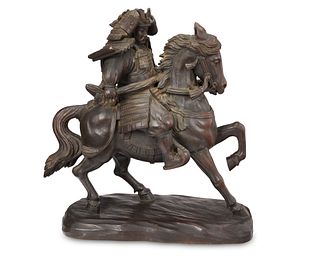 A Japanese carved wood mounted warrior sculpture