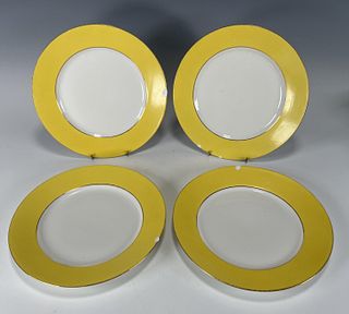 FOUR YELLOW RIMMED LIMOGES PLATES
