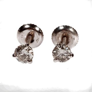 Pair of diamond and 14k white gold solitaire earrings