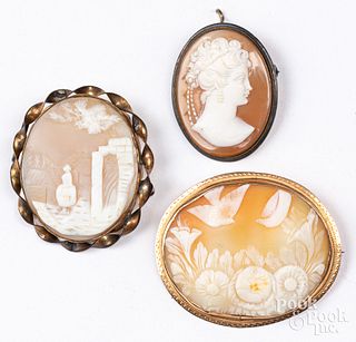 Three antique cameo brooches, one with gold mount