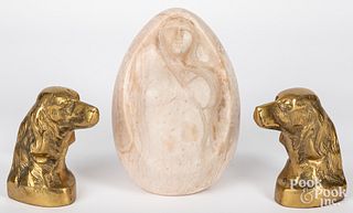 Carved stone female sculpture, dog bookends