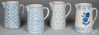 Four blue and white spongeware pitchers, 19th c.