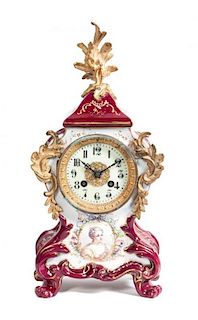 A French Gilt Metal Mounted Porcelain Mantle Clock, Height 16 inches.