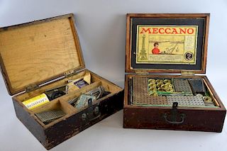 Two mahogany boxes containing Meccano No.2 part set and Trix construction sets,