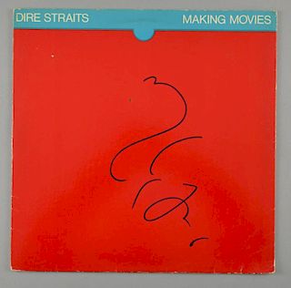 Dire Straits - A copy of the album 'Making Movies' signed to cover by Mark Knopfler in blue felt pen, together with photograp