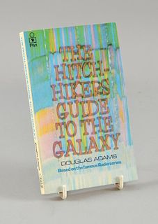 The Hitch-Hikers Guide to the Galaxy, paperback 1st edition book signed to the inside by the author Douglas Adams